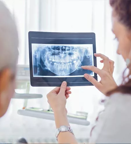 Dentist explaining x-ray to patient